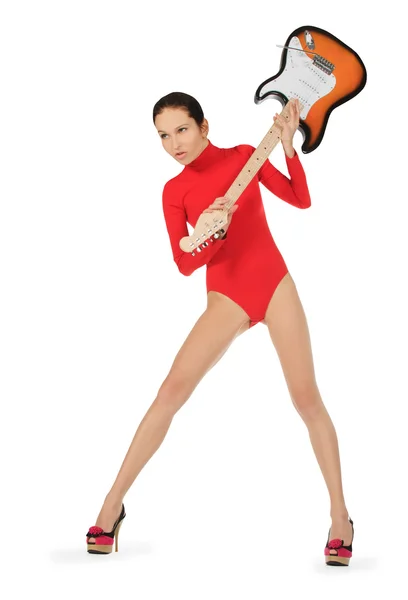 Woman breaking a guitar over white background — Stock Photo, Image