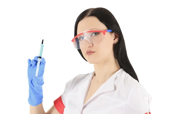 Female doctor wearing a protective glasses with syringe — Stock Photo, Image