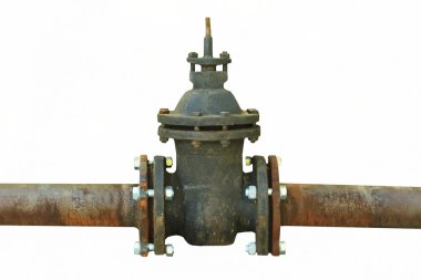 Old rusty pipe with shut-off valve over green grass clipart