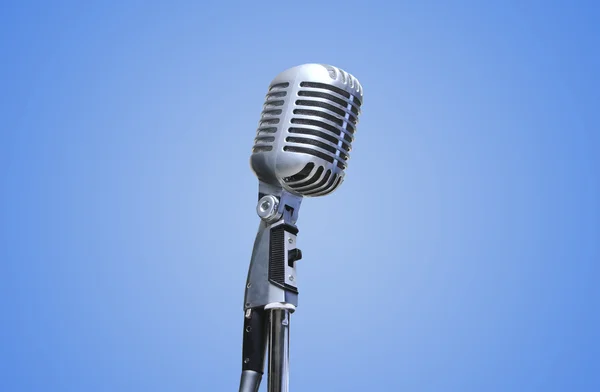 Vintage Microphone over blue background — Stock Photo, Image