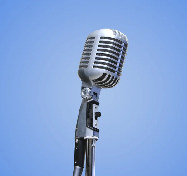 Vintage Microphone over blue background — Stock Photo, Image