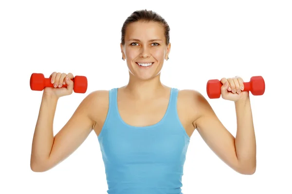 Girl with barbells in front of white background — Stock Photo, Image