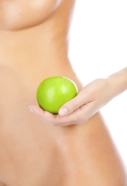 Hermoso cuerpo de mujer y manzana verde . — Foto de Stock