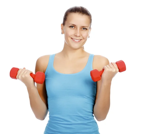 Pretty woman with red barbells posing against white background — Stock Photo, Image