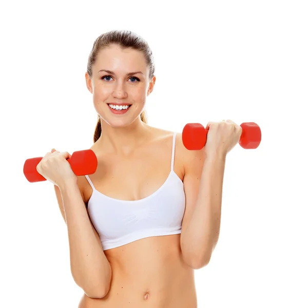 Pretty girl with red barbells posing against white background — Stock Photo, Image