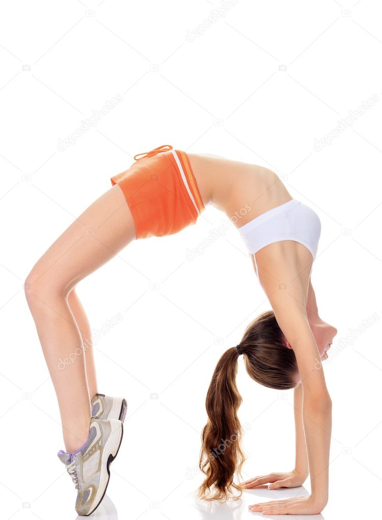 Beautiful fitness girl exercising gymnastic bridge