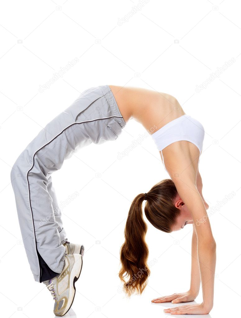 Beautiful fitness girl exercising gymnastic bridge
