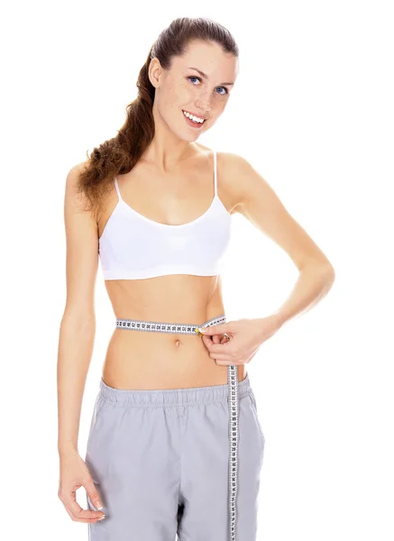 Hermosa mujer con un cuerpo perfecto que mide la cintura con la medición —  Fotos de Stock
