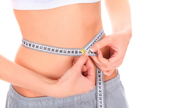 Woman measuring waistline — Stock Photo, Image