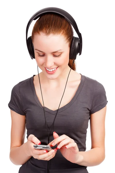Söt flicka lyssnar musik — Stockfoto
