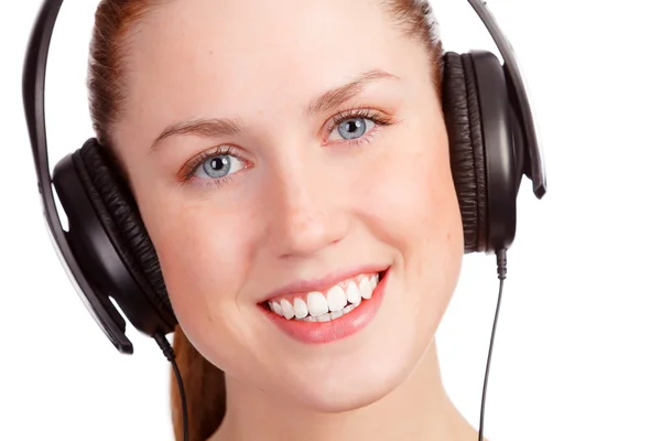 Pretty young girl listening music — Stock Photo, Image