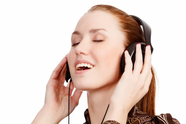 Closeup portrait of pretty young girl listening music — Stock Photo, Image
