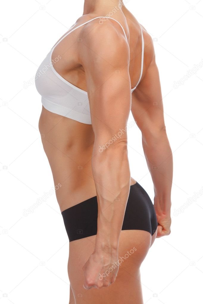 Female fitness bodybuilder posing against white background