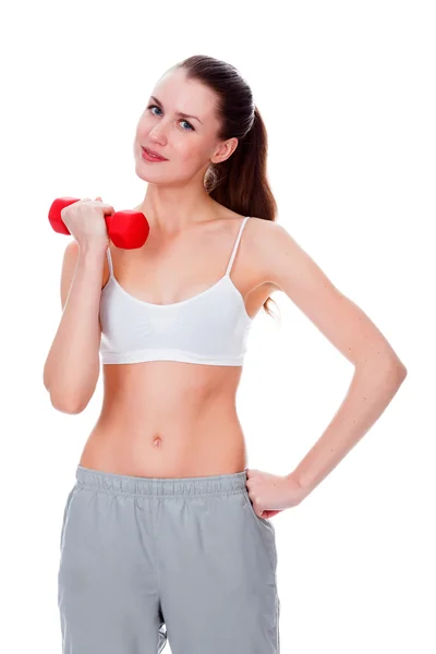 Pretty woman with red barbells posing against white background — Stock Photo, Image