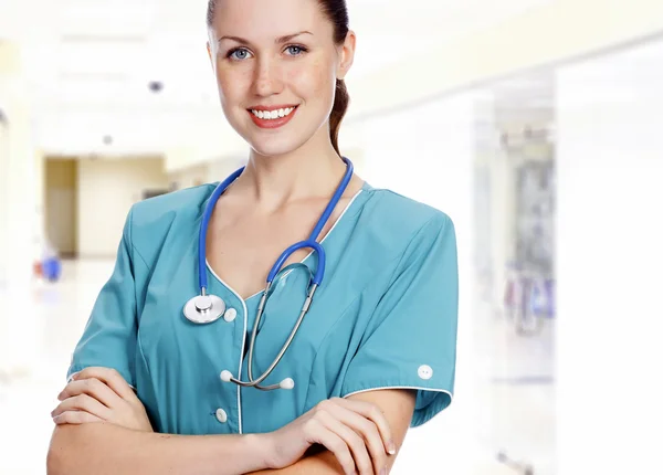 Woman doctor smiling to you Royalty Free Stock Photos