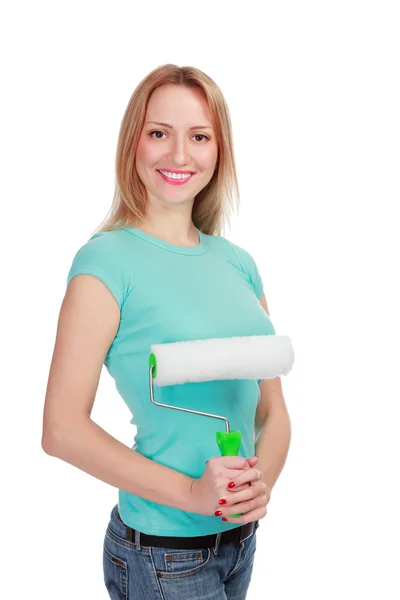 Lachende vrouw met een borstel tegen de witte achtergrond — Stockfoto