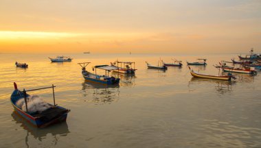 Fisherman boat on sunset clipart