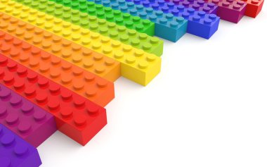 Colored toy bricks on white background clipart