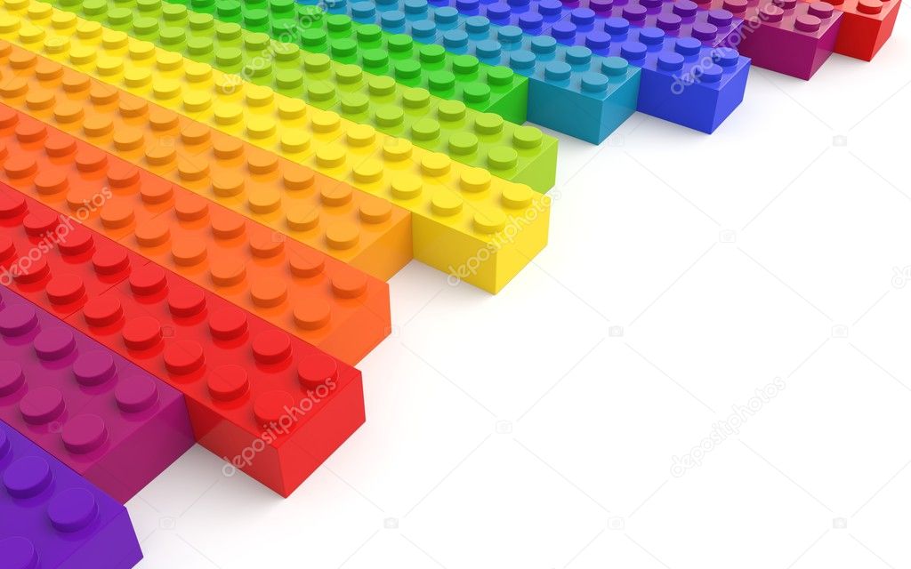Colored toy bricks on white background