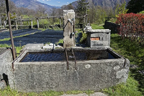 Stone fountain at mountain — Stock Photo, Image