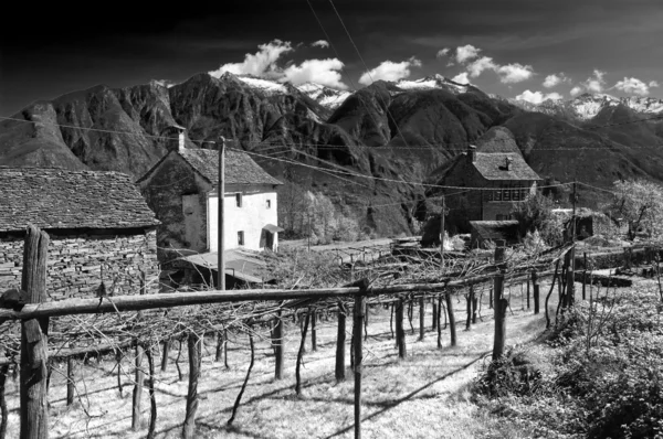 Infrared image of an alpine village — Stock Photo, Image