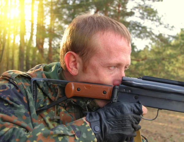 stock image The shooter in camouflage with a gun