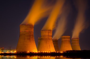 The cooling towers at night of the nuclear power generation plan clipart