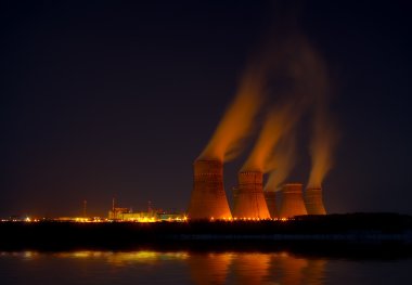 The nuclear power generation plant at night clipart