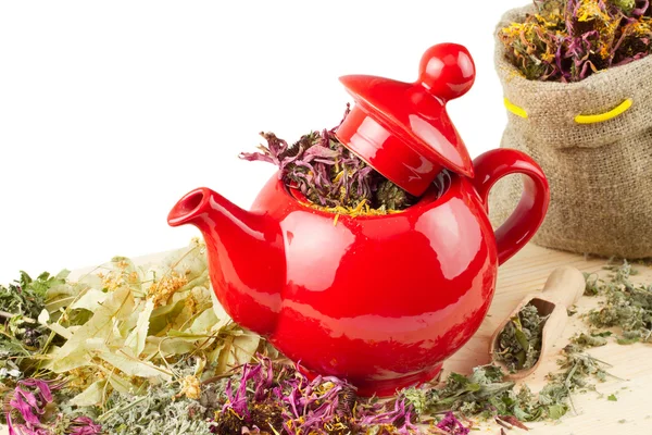 Red teapot, mortar and pestle, sack with healing herbs — Stock Photo, Image