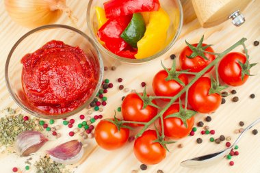 Ingredients for making tomato sauce with slices of bell pepper clipart