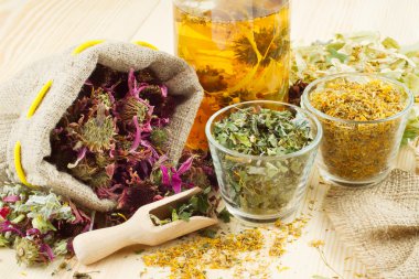 Healing herbs and healthy tea on wooden table, herbal medicine