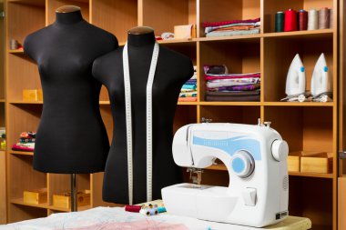 Fashion designer studio with dressmakers professional equipment clipart