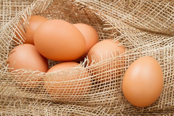 Eggs on burlap — Stock Photo, Image