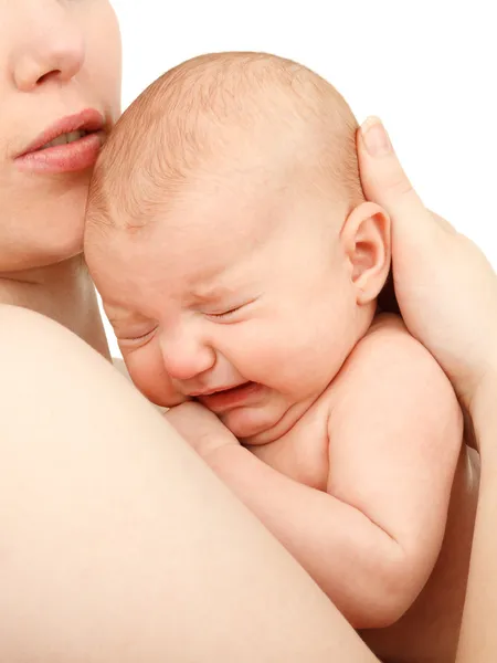 Mother holding her crying baby — Stock Photo, Image