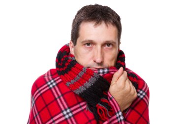 Man wrapped in a warm blanket shivering from the cold clipart