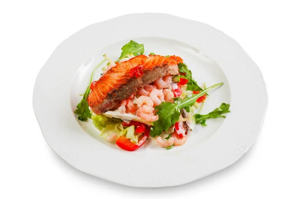 Pork chop with a slice of salmon on top, garnished with shrimp — Stock Photo, Image