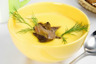 Yellow vegetable cream soup with meat clipart