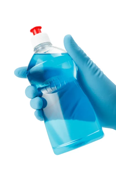 Hand in glove holding bottle of blue dish washing liquid — Stock Photo, Image
