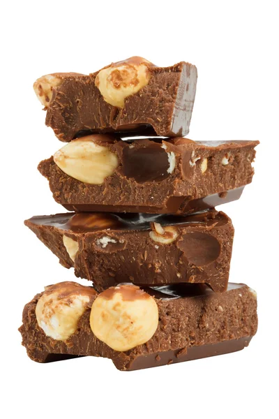 Stack of chocolate pieces with hazelnuts, close up — Stock Photo, Image