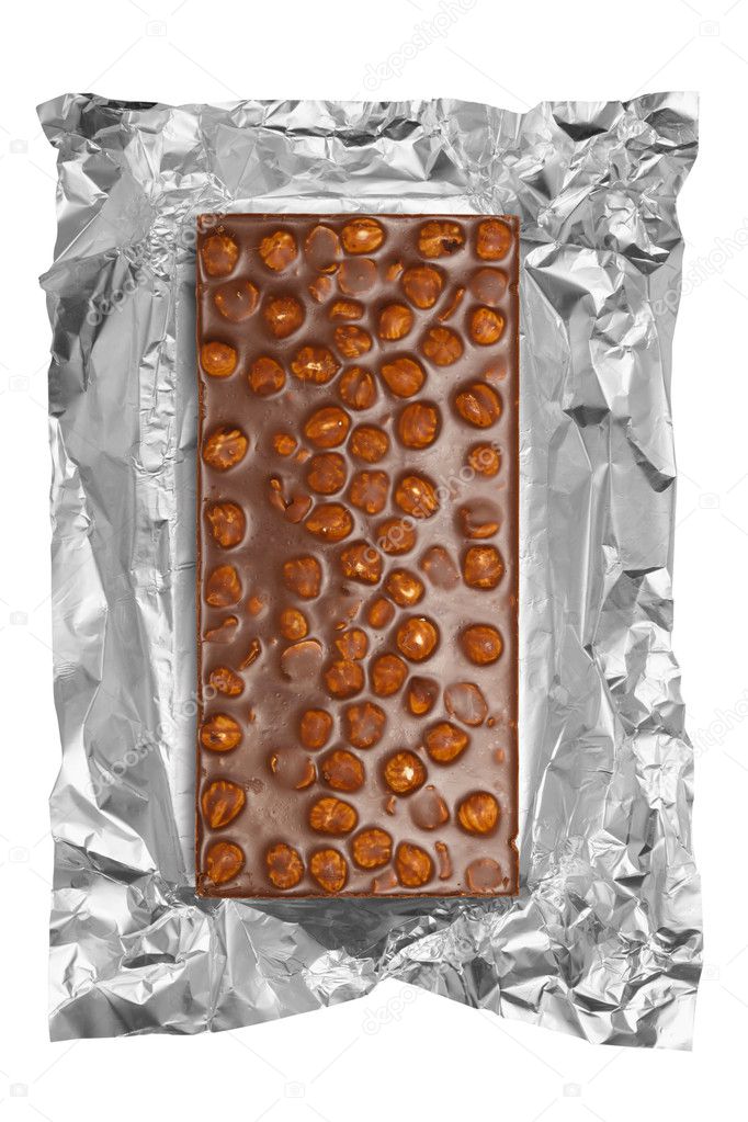 Chocolate bar with hazelnuts in aluminum foil