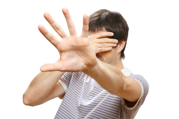 Hombre escondiendo su cara con las manos — Foto de Stock