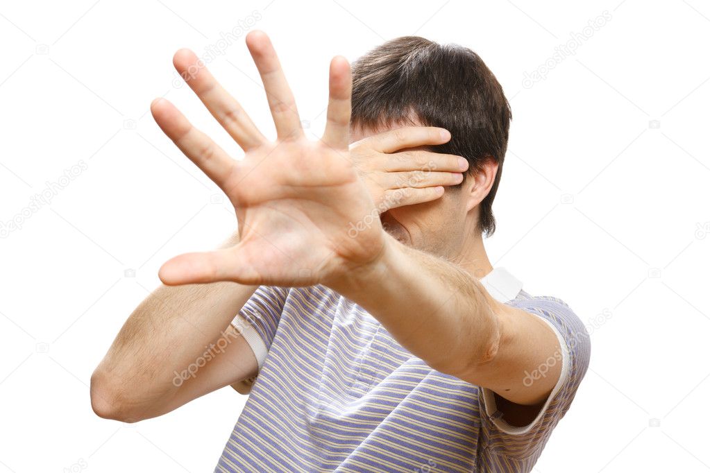 Man hiding his face with the hands