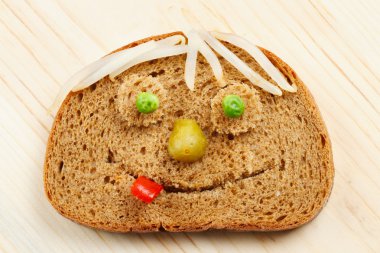 Bread slice as smiling face clipart