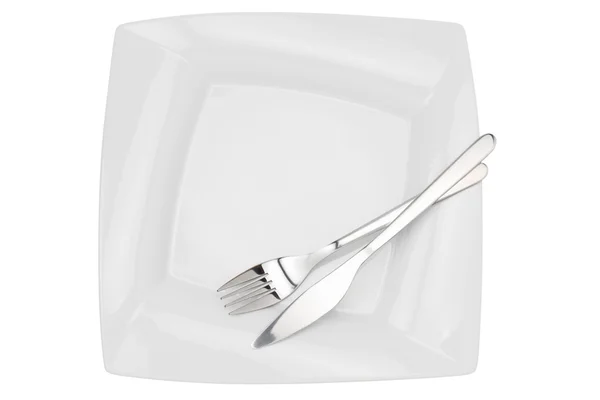 Piatto quadrato vuoto, coltello e forchetta, vista dall'alto, isolato su bianco — Foto Stock