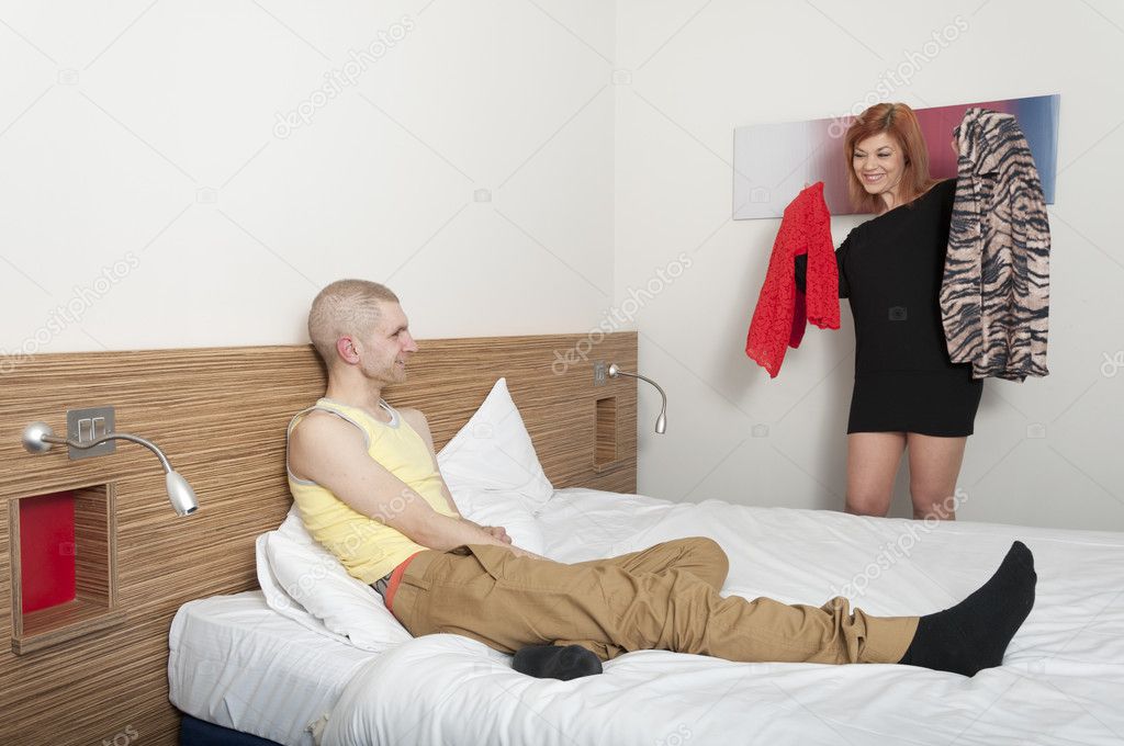 Young couple in hotel room