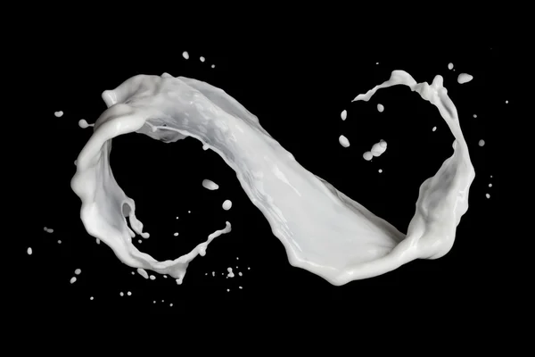 Símbolo infinito de salpicadura de leche aislado en negro — Foto de Stock