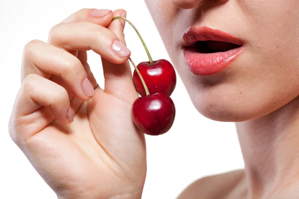 stock image Young woman with cherry isolated on white