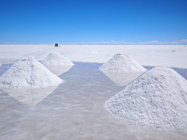 Drying salt piles on the salar clipart