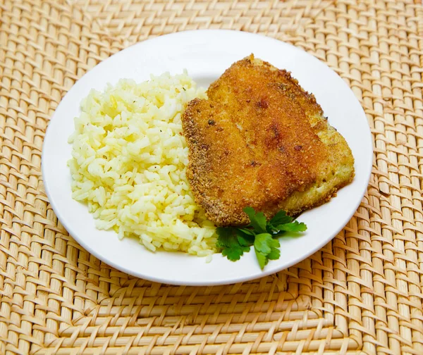 stock image Fried tilapia with rice garnish