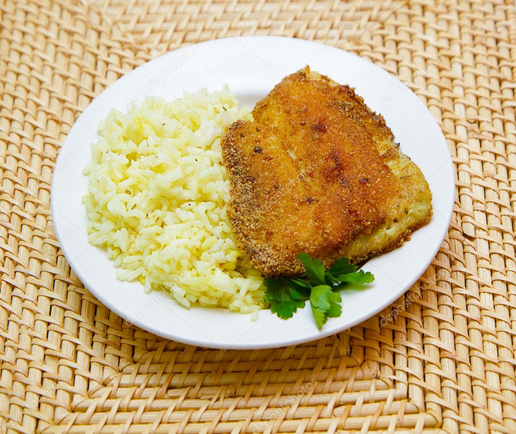 Fried tilapia with rice garnish — Stock Photo © pzRomashka 10251431